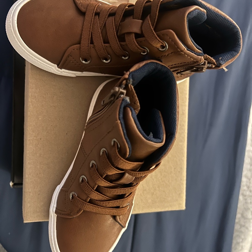 Boy boots brand new, too small for my son. Tags were taken off by him